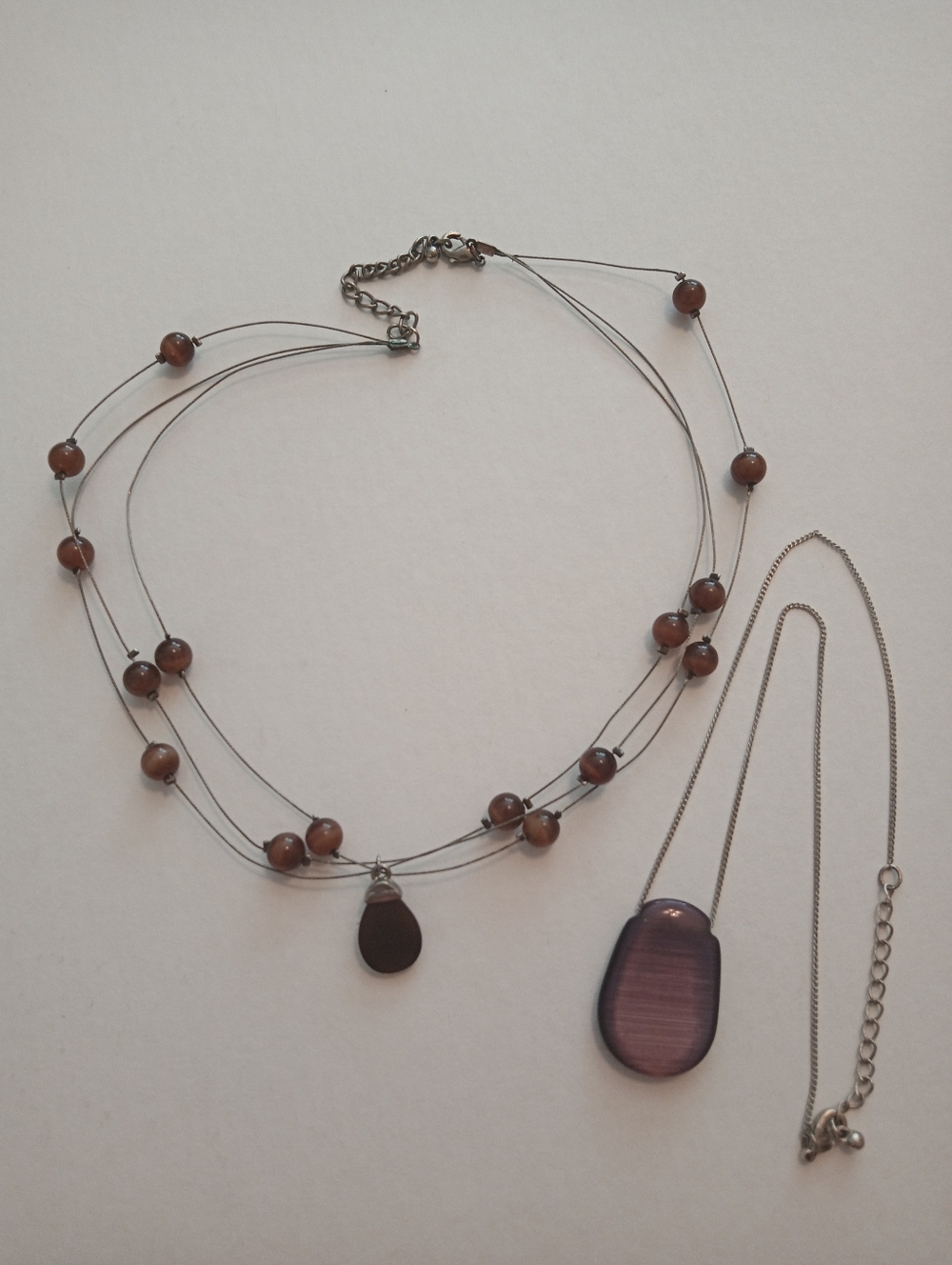 #1218. 2 Piece Brown & Purple Glass Cats Eye, Necklace Bundle.